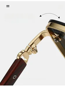 Detail of durable metal hinge on classic double-bridge sunglasses with wood grain arms