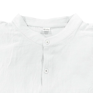 Detail of white cotton Henley shirt neckline with stand collar and size XXL tag