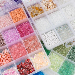 DIY jewelry kit with 12-slot box containing colorful crushed stones and faux pearls