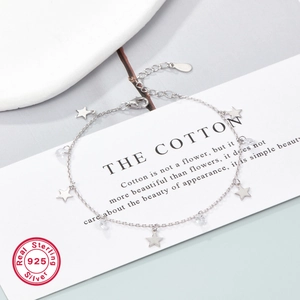 Detail of S925 sterling silver star bracelet with round cubic zirconia and lobster clasp