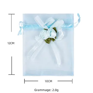 Light blue organza drawstring gift bag with handmade blue rose decoration, 10x12cm size