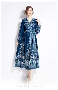 Detail of dark blue paisley print maxi dress with V-neck wrap design and waist tie