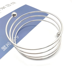 Polished silver stainless steel spiral bracelet with sphere charm ends for men and women