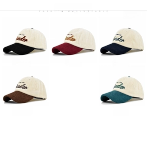 Close-up of five corduroy baseball caps featuring Wild and Wonder high-density embroidery
