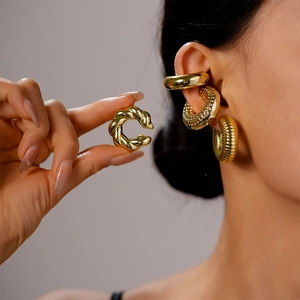 Metallic gold ear cuff set featuring twisted rope, smooth, and textured rib designs for women