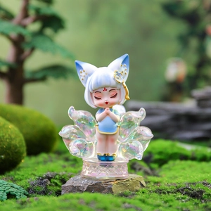 Close-up of a resin Nine-Tailed Fox fairy figurine in blue qipao on a rainbow base