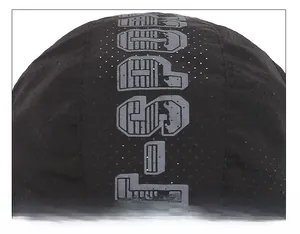 Close-up of breathable perforated fabric and grey print on the black peaked cap top