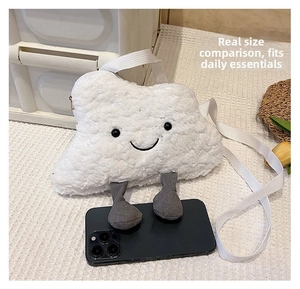 Cloud-shaped plush crossbody bag compared with a smartphone for real size display