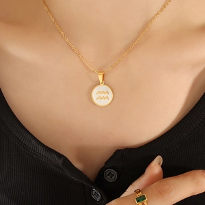 18K gold plated Aquarius constellation necklace with white seashell pendant on model