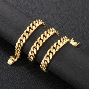 Detail of 13mm gold cuban link chain on black display stand with square box clasp