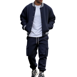 Detail of navy blue baseball jacket with striped cuffs and cargo sweatpants set