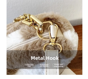 Close-up of golden hardware hook and plush brown-white faux fur texture on tote bag