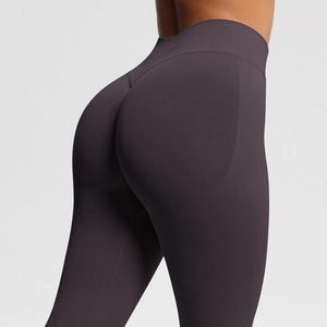 Detail of high-waisted seamless yoga leggings with peach butt lift and elastic knit fabric