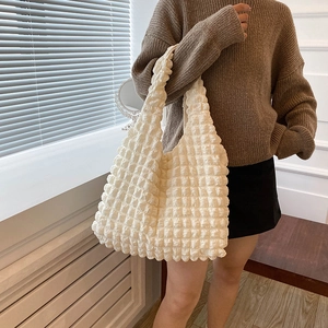 Off-white pleated tote bag for women featuring a spacious minimalist aesthetic design