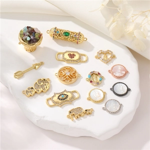 Variety of 14K gold plated DIY charms with zircon inlays including heart and eye motifs