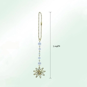 Detailed view of sun pendant hanging ornament with blue beads measuring 7.09 inches long