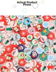 Flat lay of colorful Christmas clay beads with Santa Claus and snowman patterns