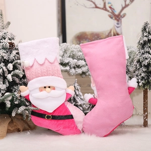 Pink Christmas stocking with 3D Santa Claus figure on a soft white faux fur rug