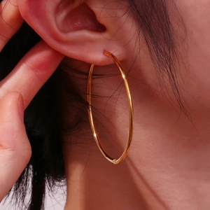 Minimalist 18K gold plated stainless steel 2mm hoop earrings for women shown on model