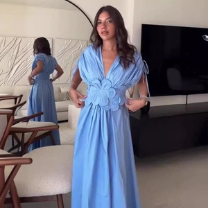 Light blue V-neck maxi dress featuring 3D floral waist detail and sleeveless design