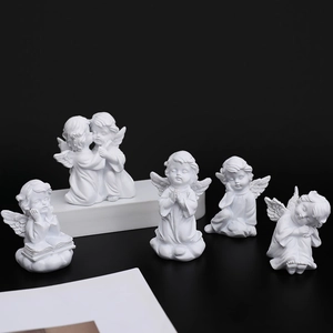 Set of 5 European resin angel figurines in prayer and sleeping poses on pedestals