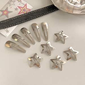 Close-up of 10-piece silver metal hair clips with hollow star and teardrop BB designs