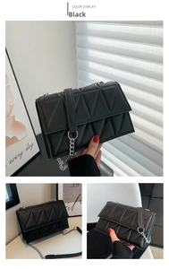 Detail of black geometric quilted crossbody bag with silver chain strap and flap closure