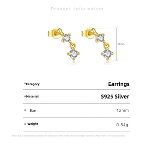 Detailed view of 12mm gold S925 silver earrings with three sparkling cubic zirconia stones