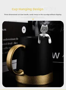 Detail of stainless steel cat claw spoon hanging on a black matte ceramic mug rim