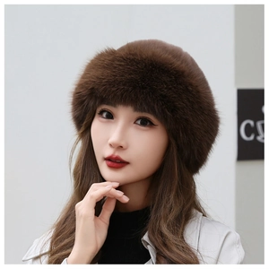Detailed texture of thick dark brown faux fur winter hat worn by a model