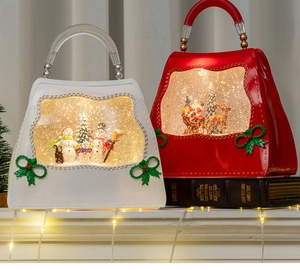 Macro view of Christmas lantern in handbag style with Santa and snowman scenes