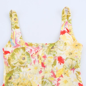 Detail of invisible back zipper and floral pattern on linen-texture summer dress