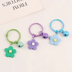 Colorful floral keychain set with small bells in green purple and blue finishes