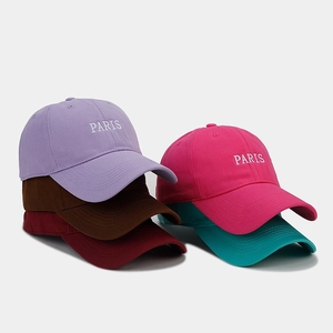 Detailed embroidery of PARIS on colorful cotton twill baseball caps in various colors