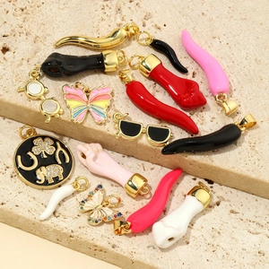 Mix of colorful enamel butterfly and Italian cornicello horn charms for DIY jewelry making