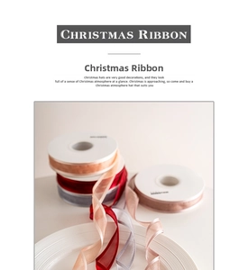 Detailed view of festive Christmas ribbons in red and grey on white paper spools