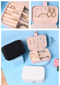 Portable jewelry box in pink, black, and white with multi-layer storage compartments