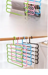 Close-up of durable 5-tier S-shaped pants hangers in multiple colors for closet storage