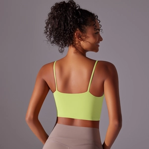 Detailed back view of neon yellow high-impact sports bra with thin straps and elastic fabric