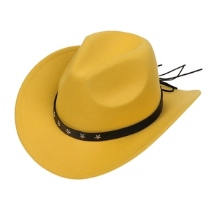 Detail of a bright yellow cowboy hat with a black belt featuring silver star studs