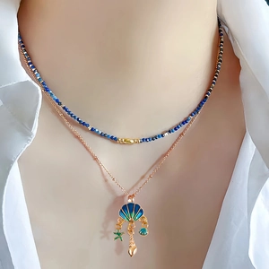 Blue ocean-style layered necklace with beaded chain and shell starfish pendants