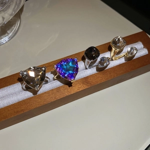 Detail of luxury geometric open rings with sparkling square and triangle crystals
