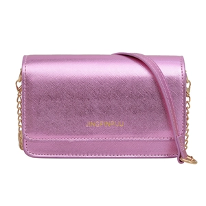 Metallic pink crossbody chain bag with textured surface and gold shoulder strap