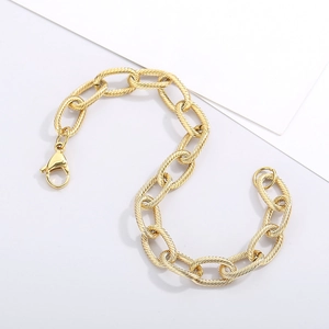 Detailed macro view of gold-plated titanium steel chain links with spiral texture