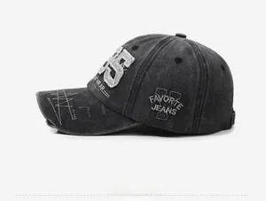 Side view of distressed black baseball cap with vintage patches and worn brim detail