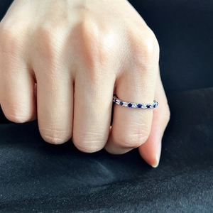 Elegant S925 sterling silver ring with blue and white zircons worn on hand