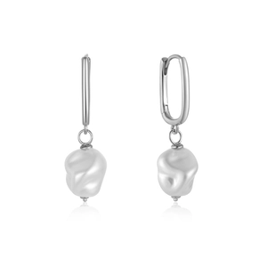 Detail view of baroque pearls with silver rectangular clasps and elegant reflections