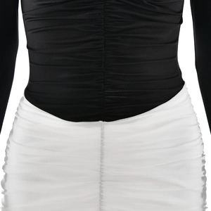 Detailed close-up of ruched waist stitching and black-white contrast mesh fabric texture
