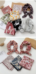 Detail of printed cotton linen square scarves with crochet lace trim in assorted patterns