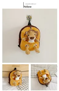 Detail view of yellow plush lion backpack for kids with a cute 3D animal figure on the front